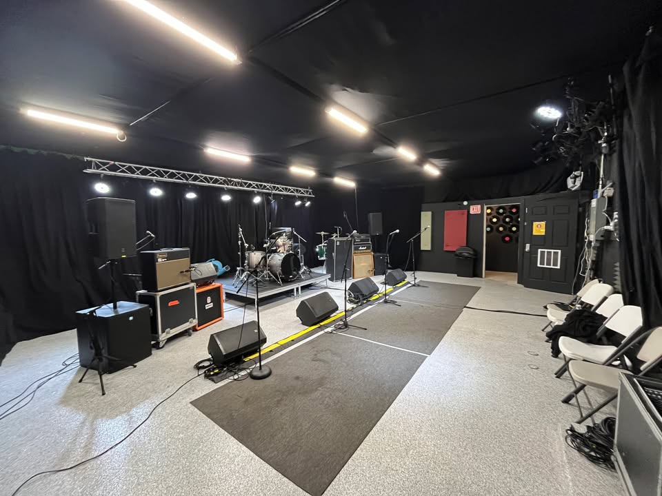 Wide view of the rehearsal floor with monitors and seating